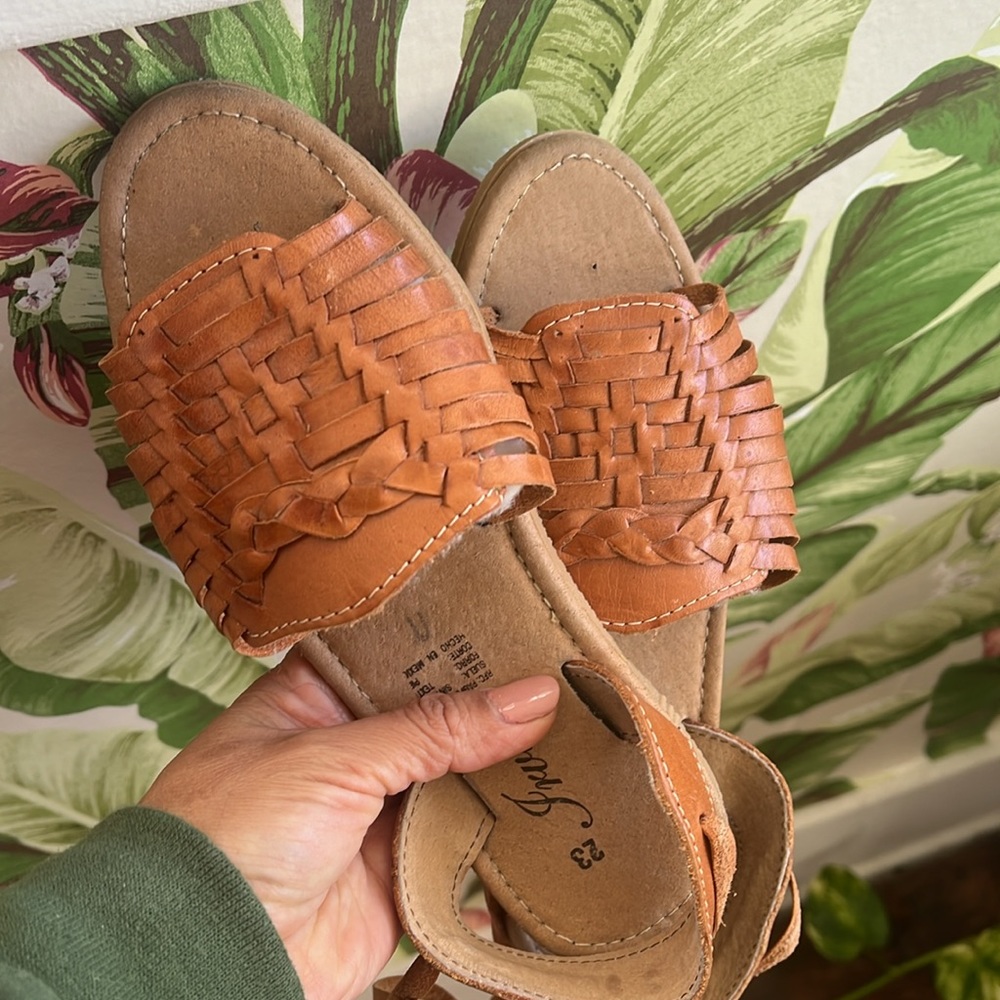 Authentic leather ankle tie sandals. Leather upper with synthetic sole. Size 7.5